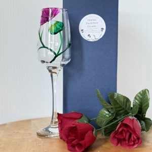 Elegant hand-painted wine glass with floral design - a perfect romantic gift.