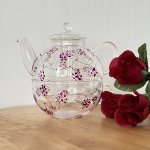 Delicate hand-painted teapot set with blossom design